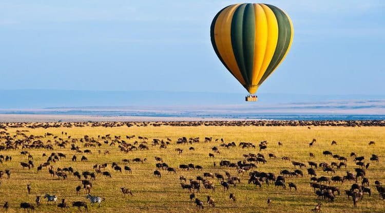 Hot-air balloon over the Serengeti plains at sunrise